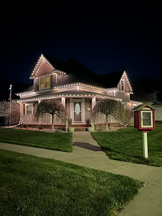 Hastings home with festive lighting at night