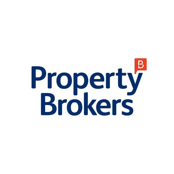 "Logo of Property Brokers in blue text with a small red icon featuring a white 'B' at the top right corner."