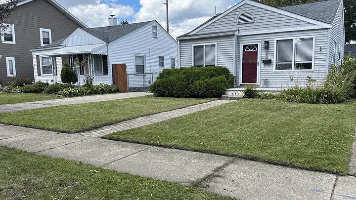KILEY Outdoor Services crew maintaining a lawn in Royal Oak
